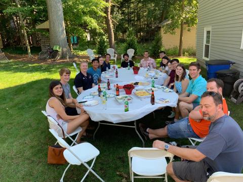 A gathering of happy necstlab 2019 BBQ attendees - firmly on the ground